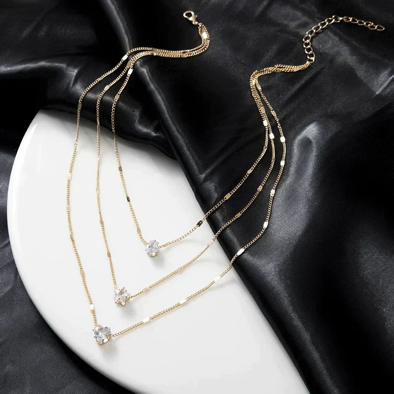 Necklace with three pendants featuring gold-plated cubic zirconia
