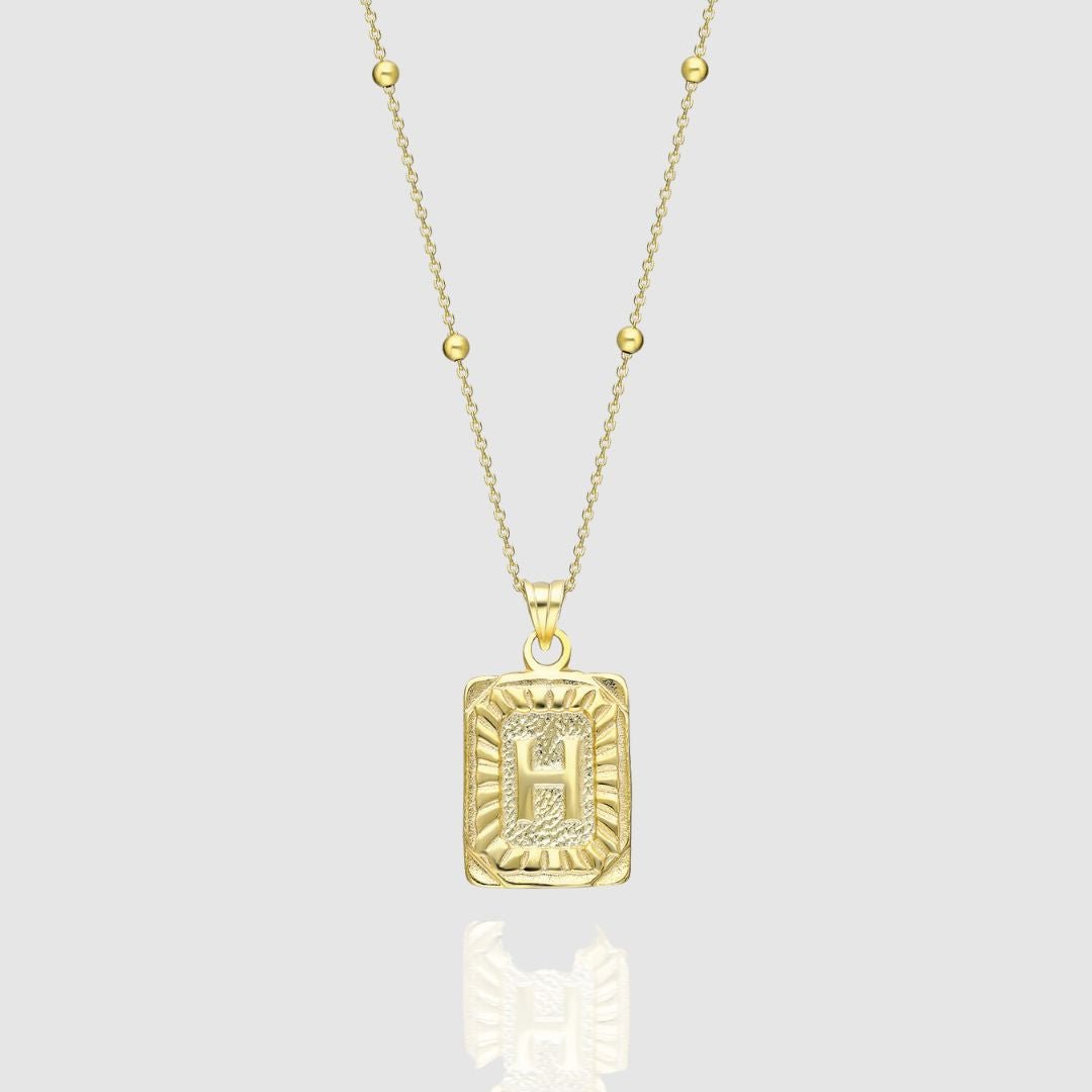 Collar con medallón de inicial
