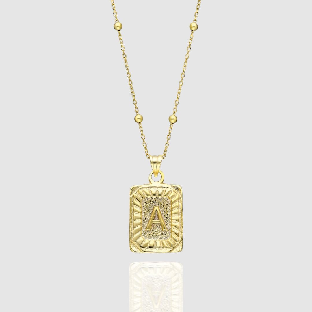 Collar con medallón de inicial